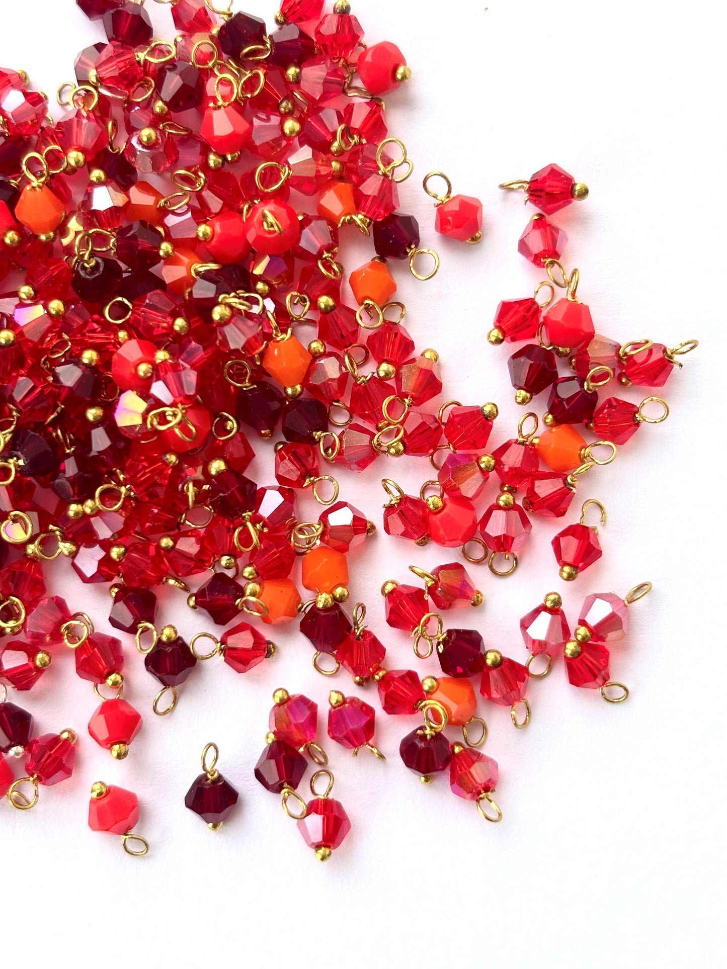 Multi Red Bicone Charms with Golden Wire