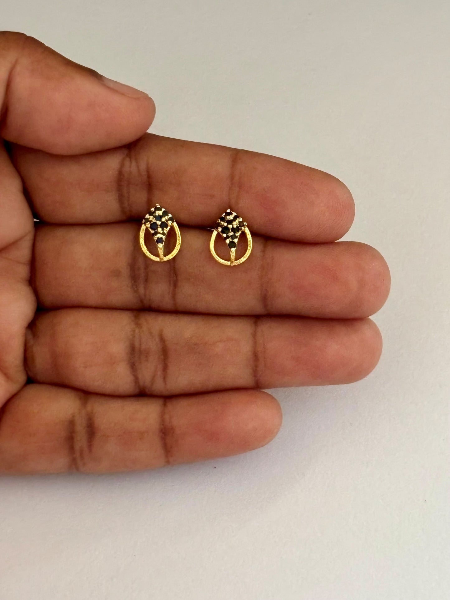 Gold-Plated Oval Stud Earrings with Black Stone Cluster