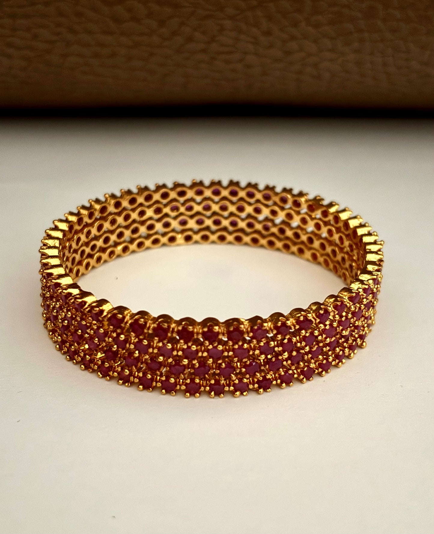 Gold-Plated Bangle Fully Studded with Ruby Pink Stones