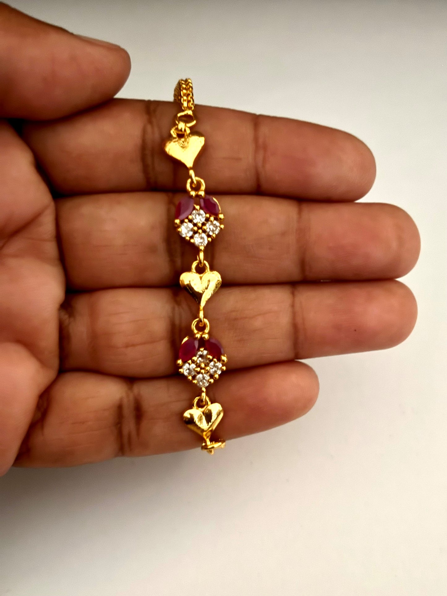 Gold-Plated Heart Bracelet with Ruby and White Stones