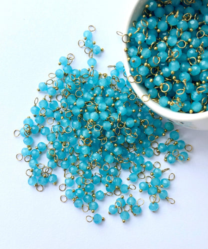 Faceted Baby Blue Charms with Golden Wire