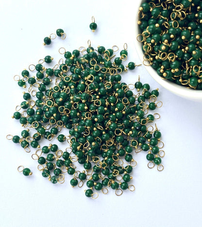 Faceted Kaitoke Green Charms with Golden Wire