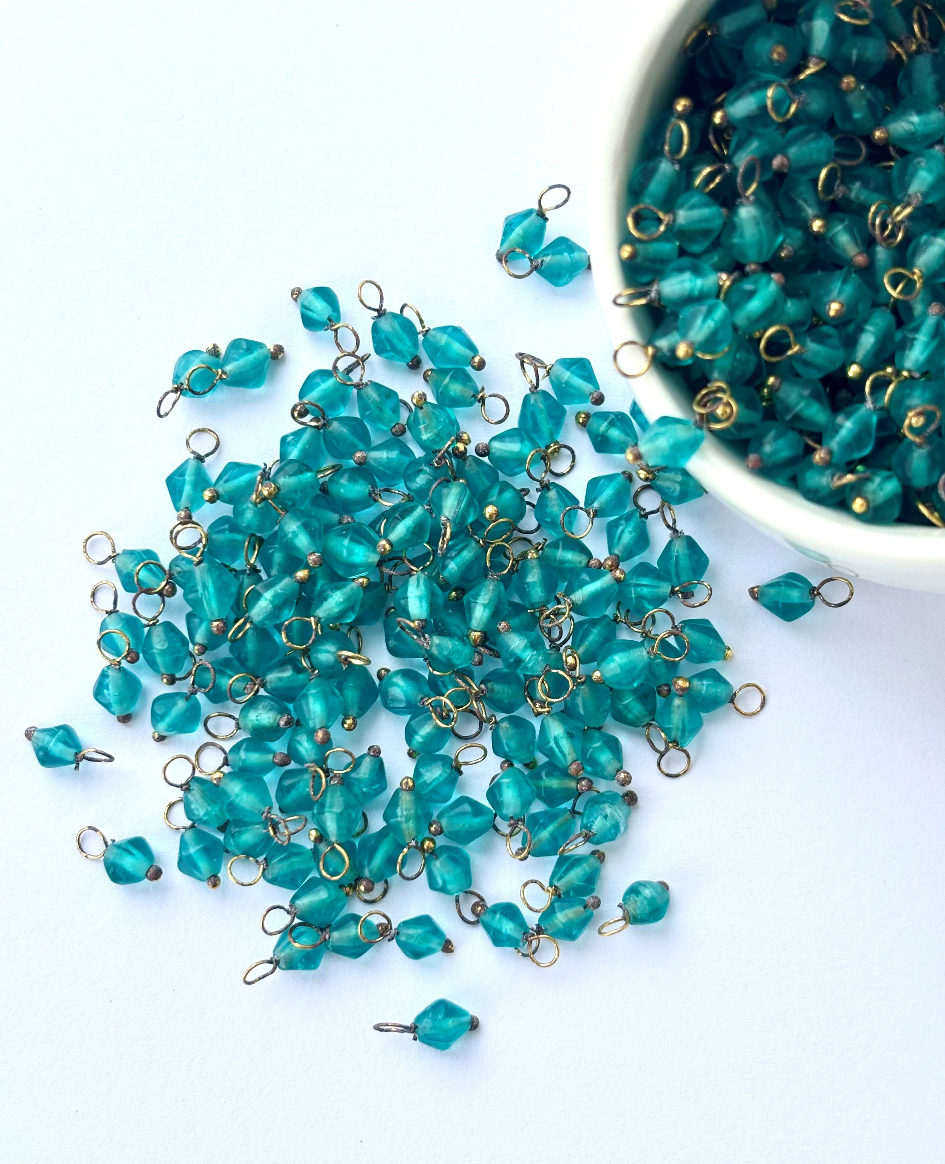 Bicone Tropical Teal Charms with Golden Wire