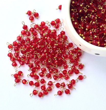 Faceted Rufous Red Charms with Golden Wire