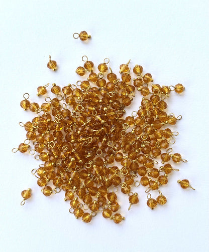 Faceted Ginger Brown Charms with Golden Wire