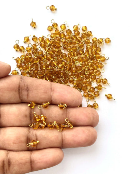 Faceted Ginger Brown Charms with Golden Wire