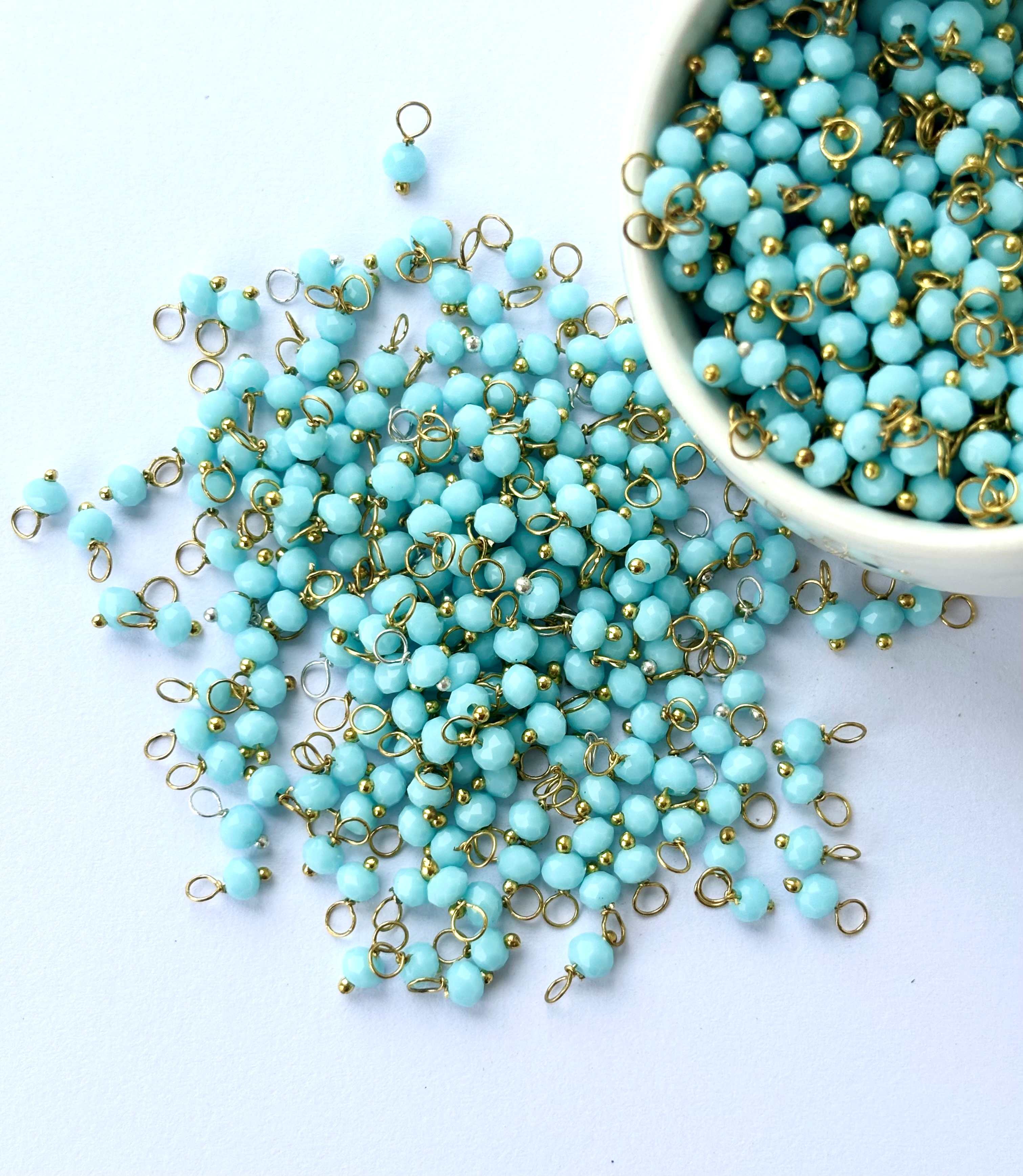 Faceted Artic Blue Charms with Golden Wire