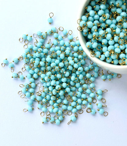 Faceted Artic Blue Charms with Golden Wire