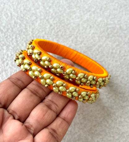 Orange Silk Thread Bangles with Petal Work