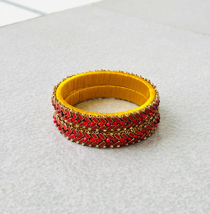 Yellow Bangles with Red Rhinestone Work