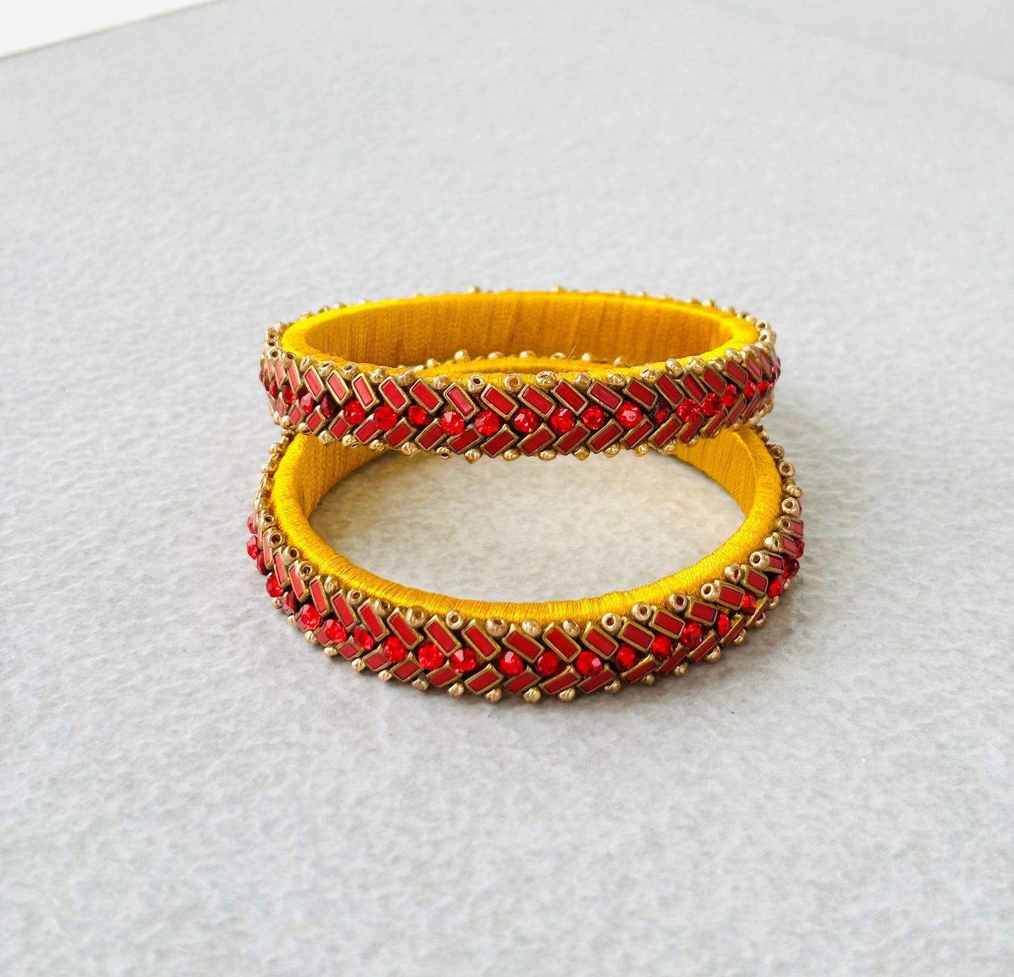 Yellow Bangles with Red Rhinestone Work