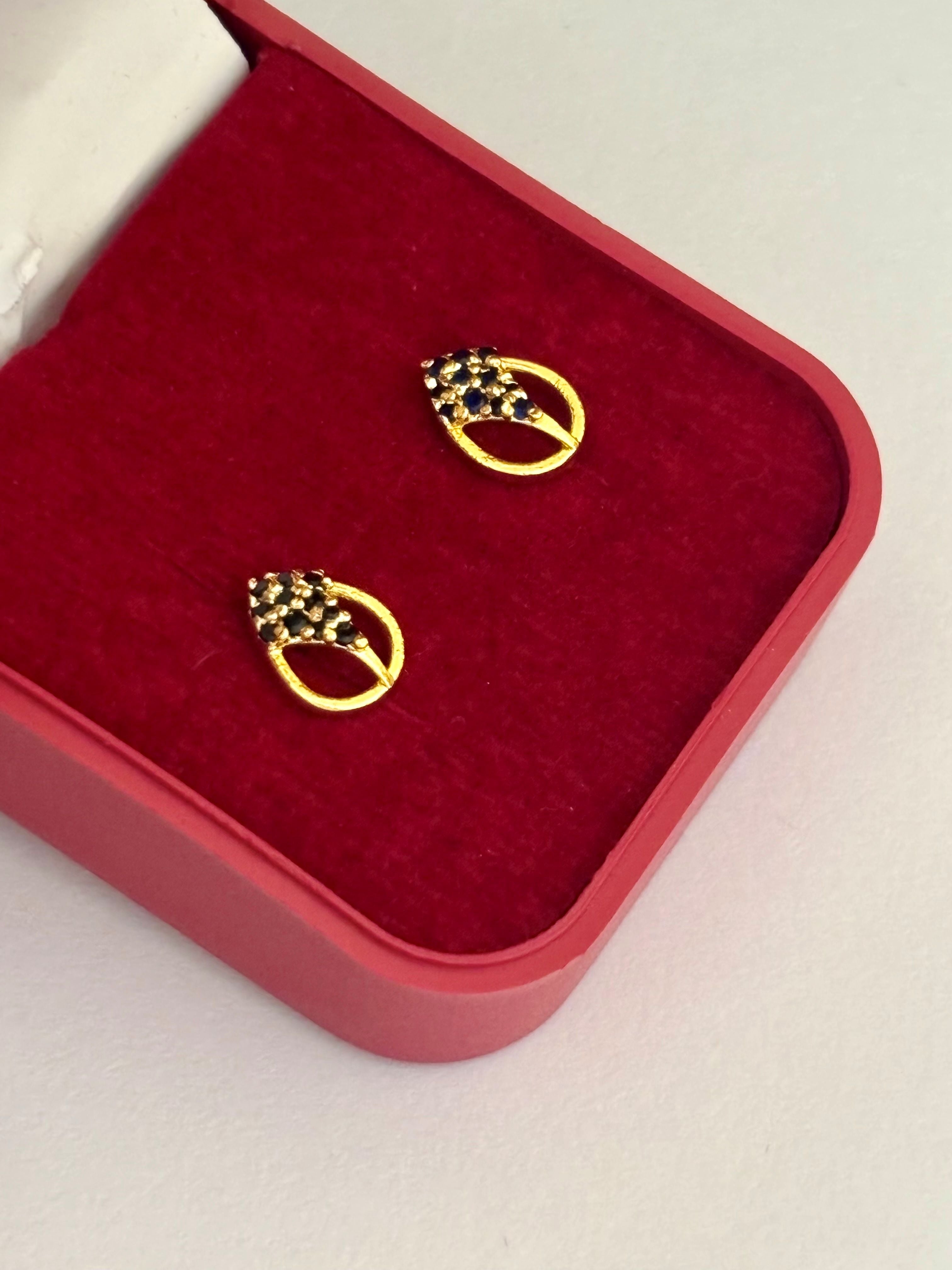 Gold-Plated Oval Stud Earrings with Black Stone Cluster