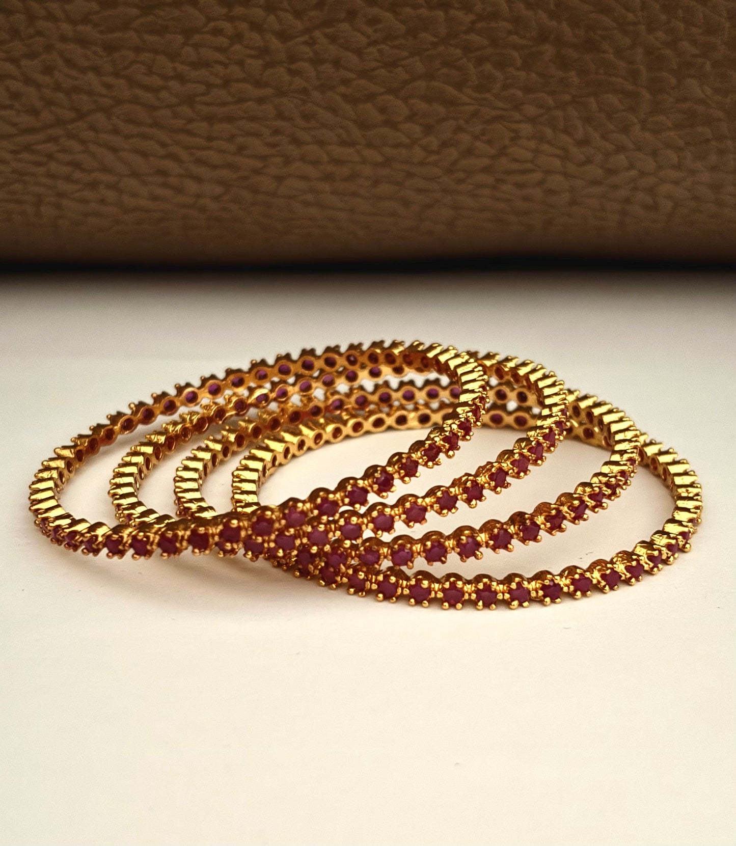 Gold-Plated Bangle Fully Studded with Ruby Pink Stones