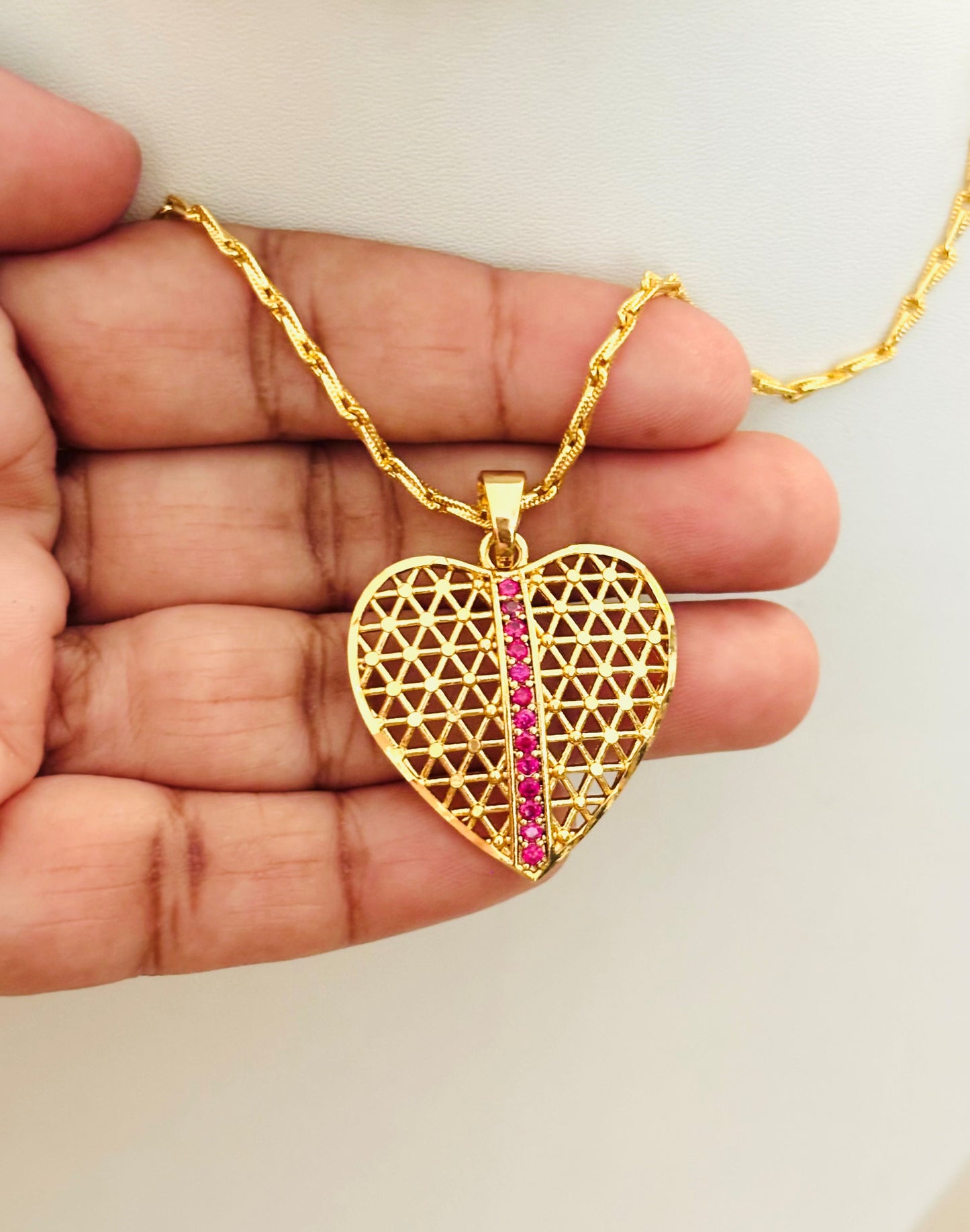 Gold-Plated Filigree Heart Pendant with Pink Ruby Stripe