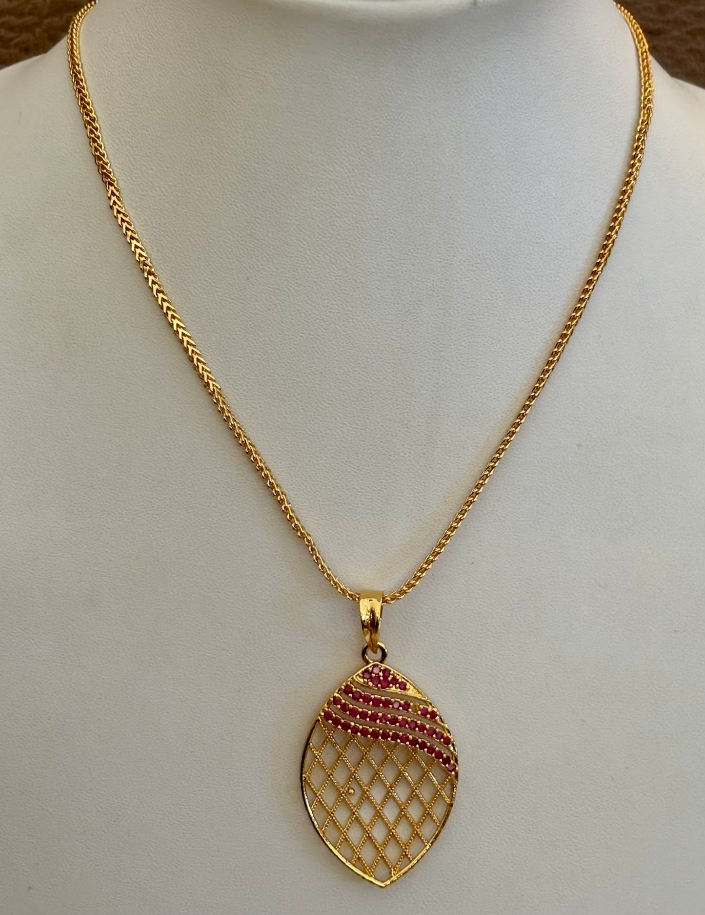 Gold-Plated Jali Work Pendant with Pink Ruby Stones