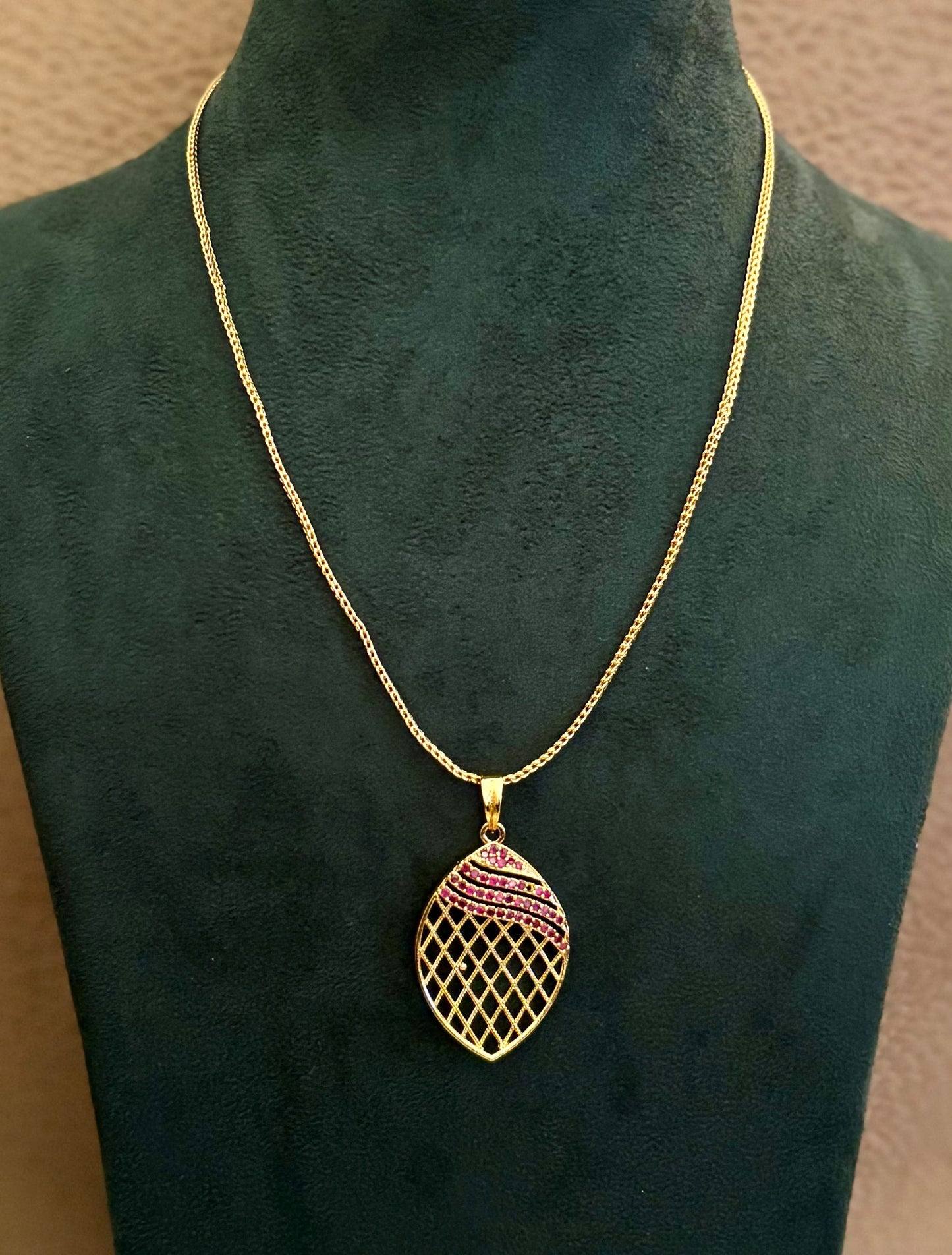 Gold-Plated Jali Work Pendant with Pink Ruby Stones