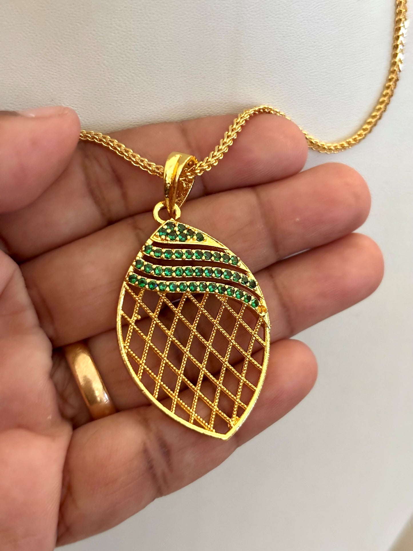 Gold-Plated Jali Work Pendant with Green Emerald Stones