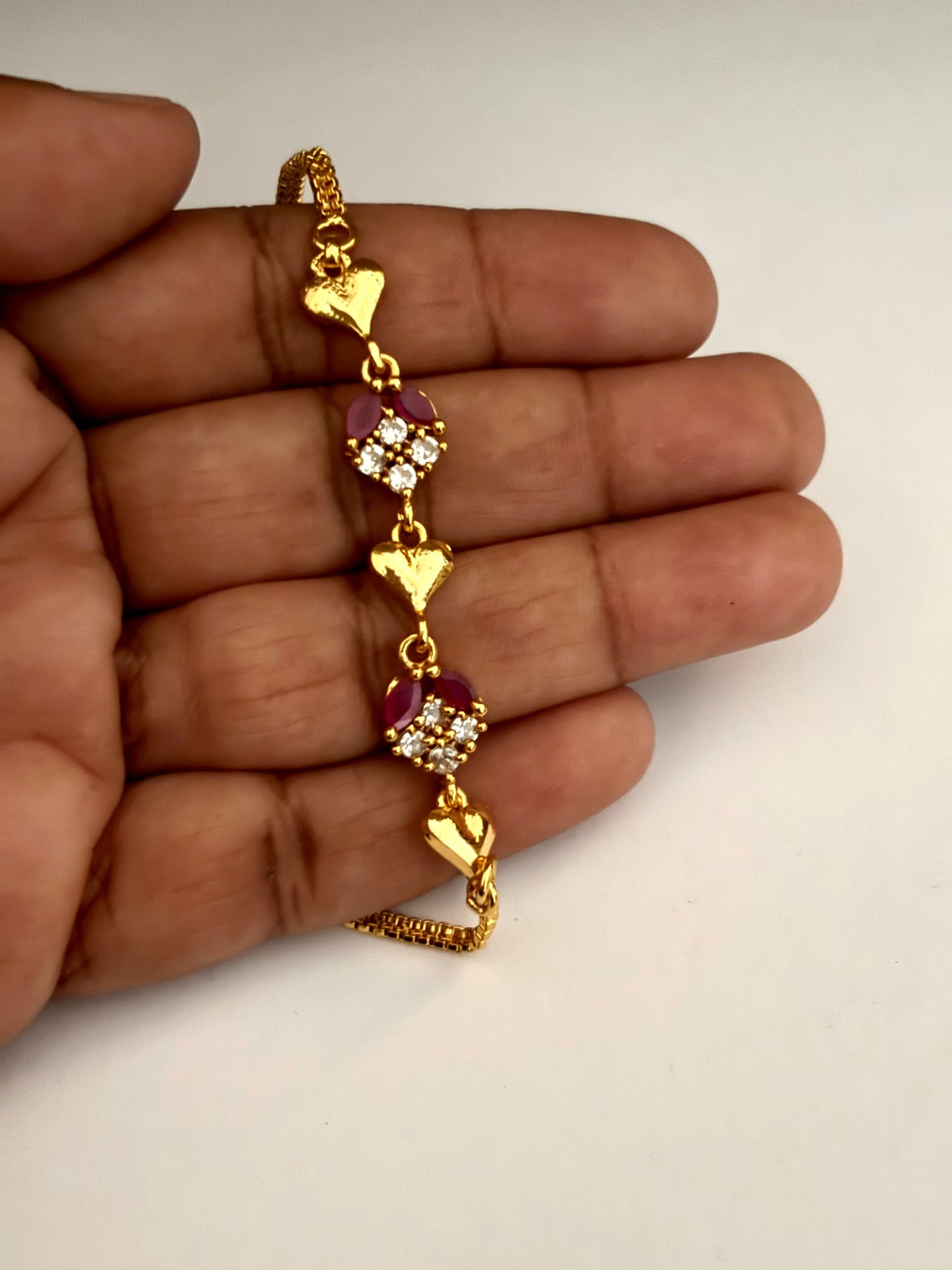 Gold-Plated Heart Bracelet with Ruby and White Stones