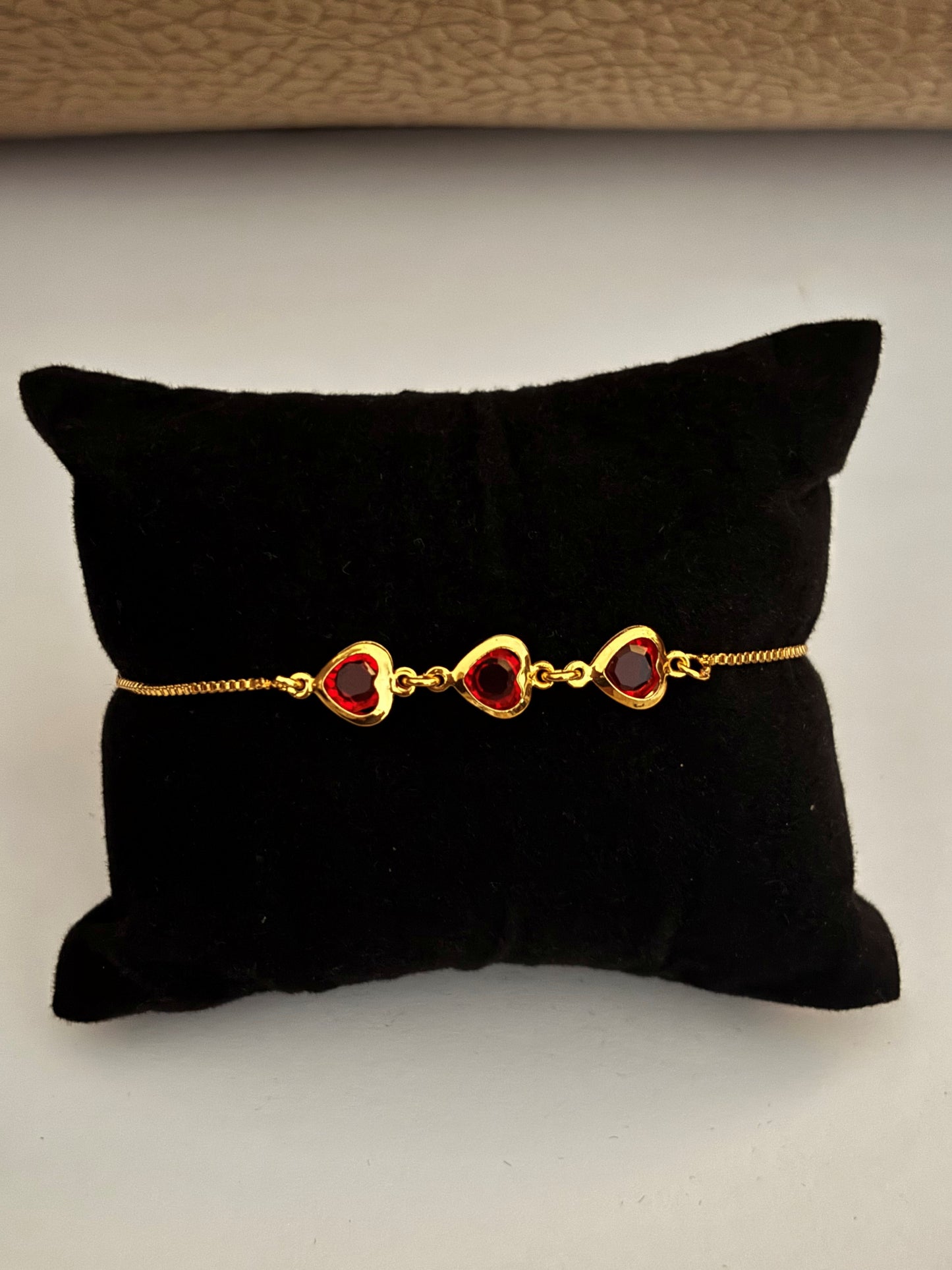 Gold-Plated Bracelet with Three Red Heart Stones