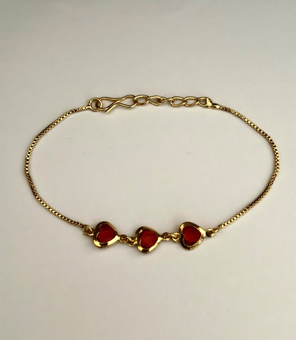 Gold-Plated Bracelet with Three Red Heart Stones