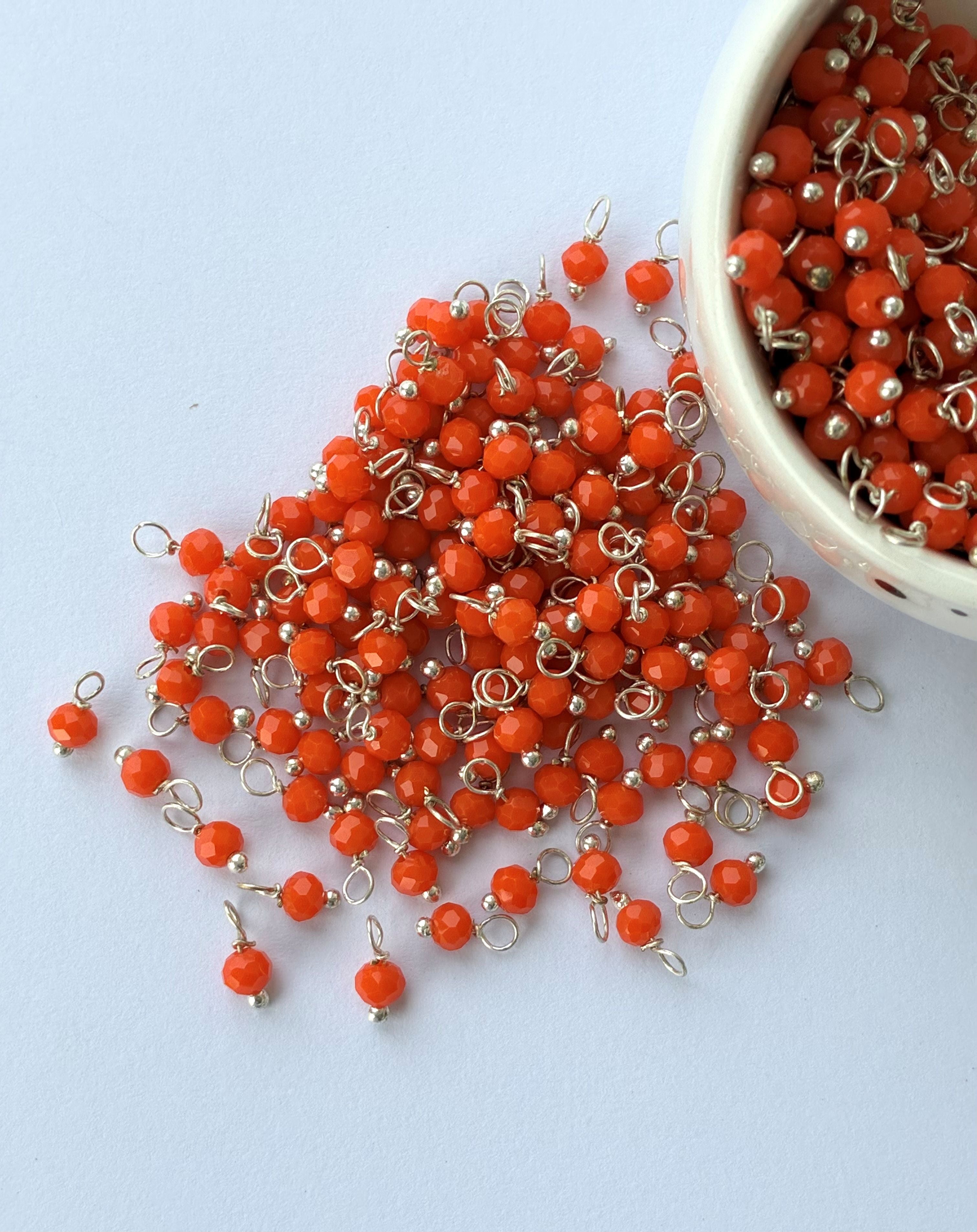 Faceted Orange Bead Charms with Silver Wire