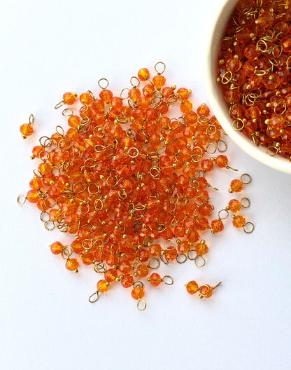 Faceted Fanta Orange Bead Charms with Gold Wire