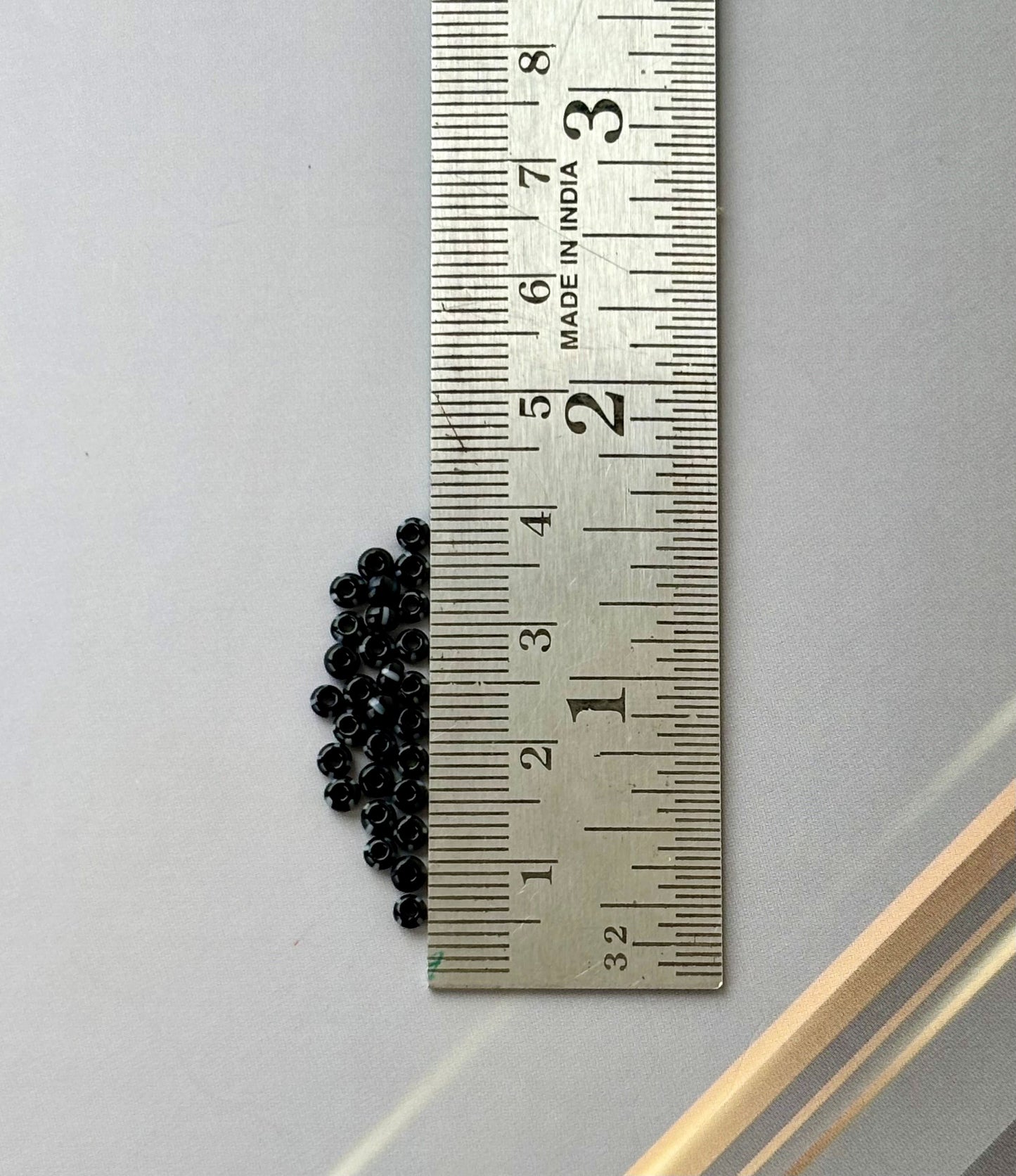 Preciosa White Lined Black Seed Beads