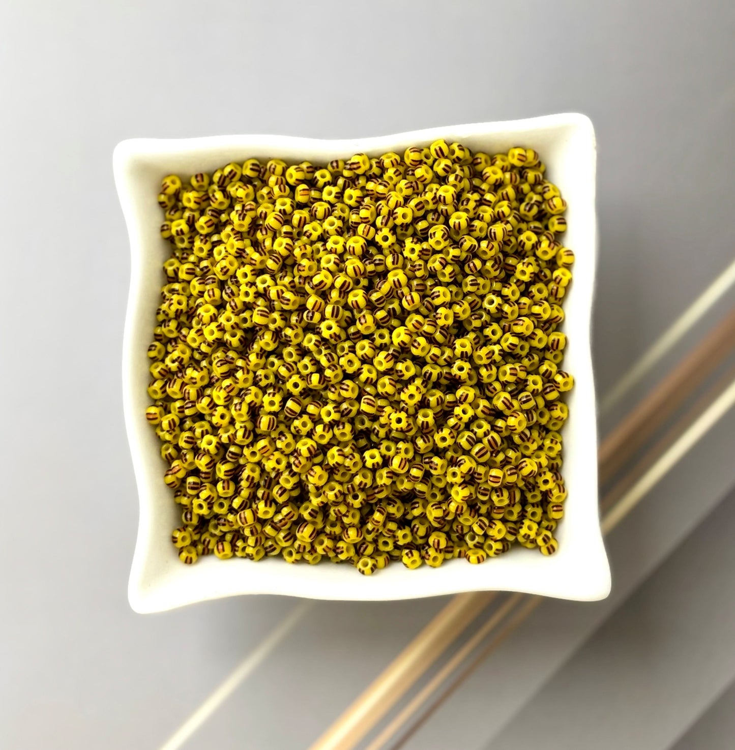 Preciosa Yellow with Brown Stripe Seed Beads