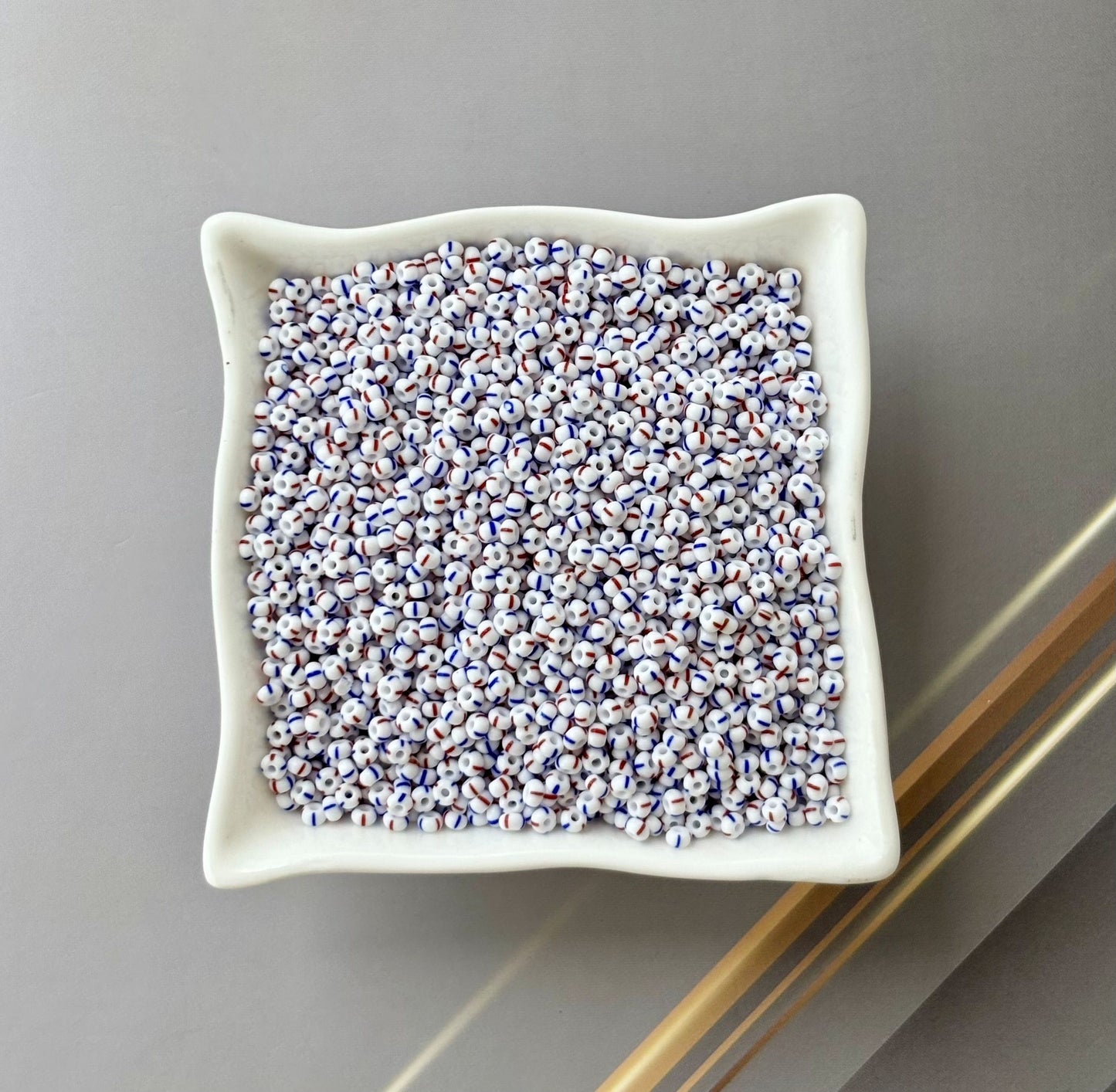 Preciosa White with Blue and Red Thin Stripe Seed Beads