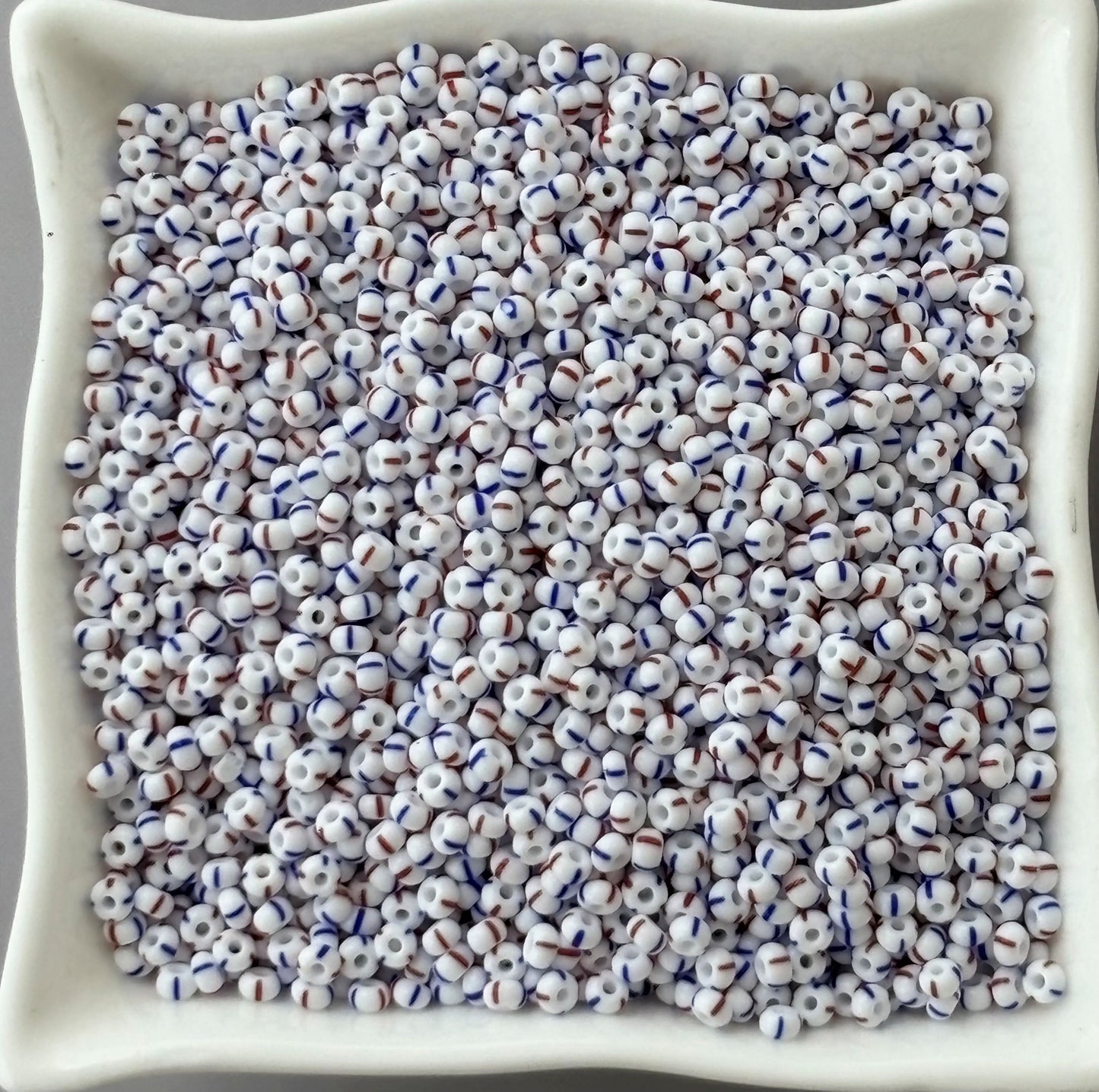 Preciosa White with Blue and Red Thin Stripe Seed Beads