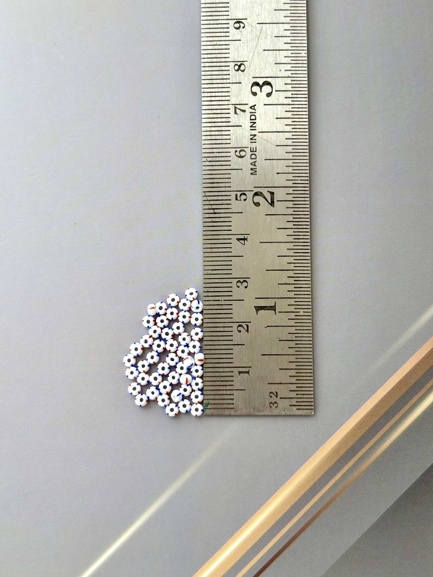 Preciosa White with Blue and Red Thin Stripe Seed Beads