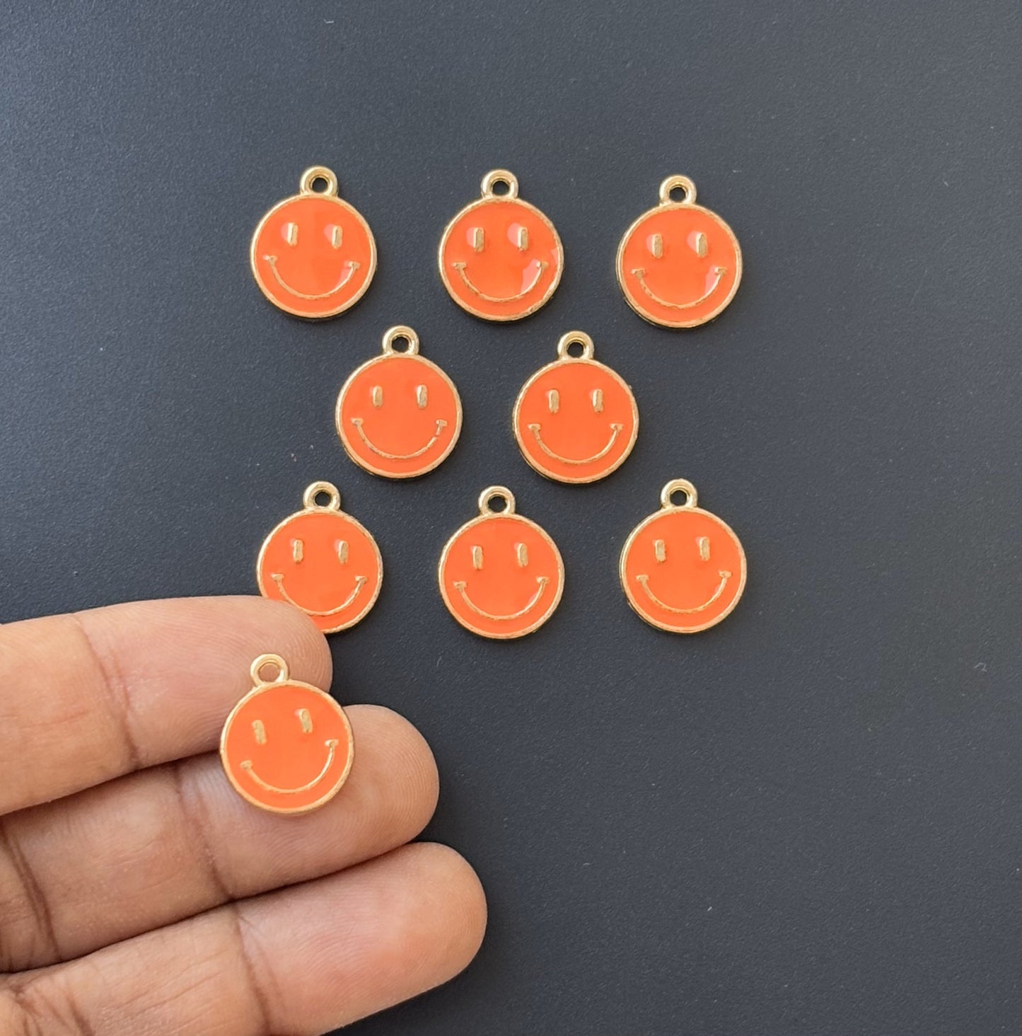 Four Pieces Enamelled Charms - Orange Smiley Charms
