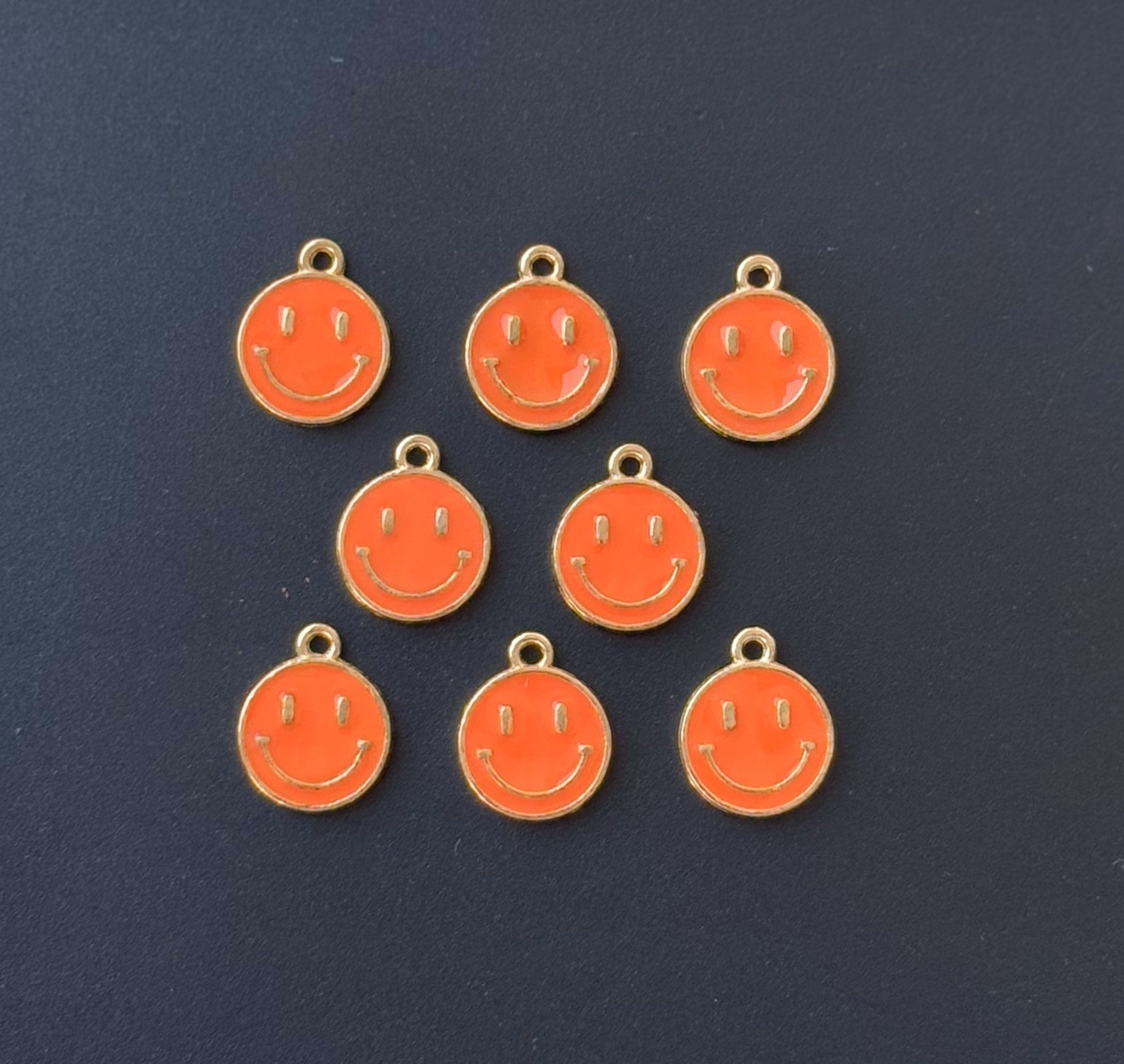 Four Pieces Enamelled Charms - Orange Smiley Charms