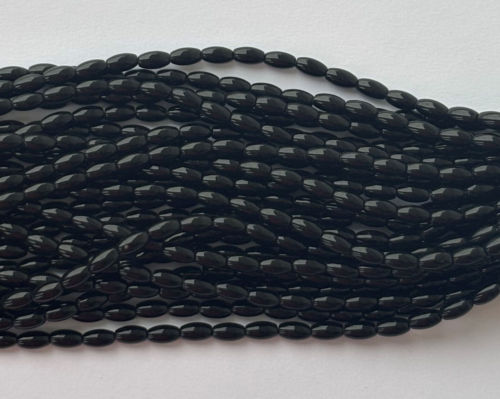 Smooth High Shine Monalisa Black Oval Beads