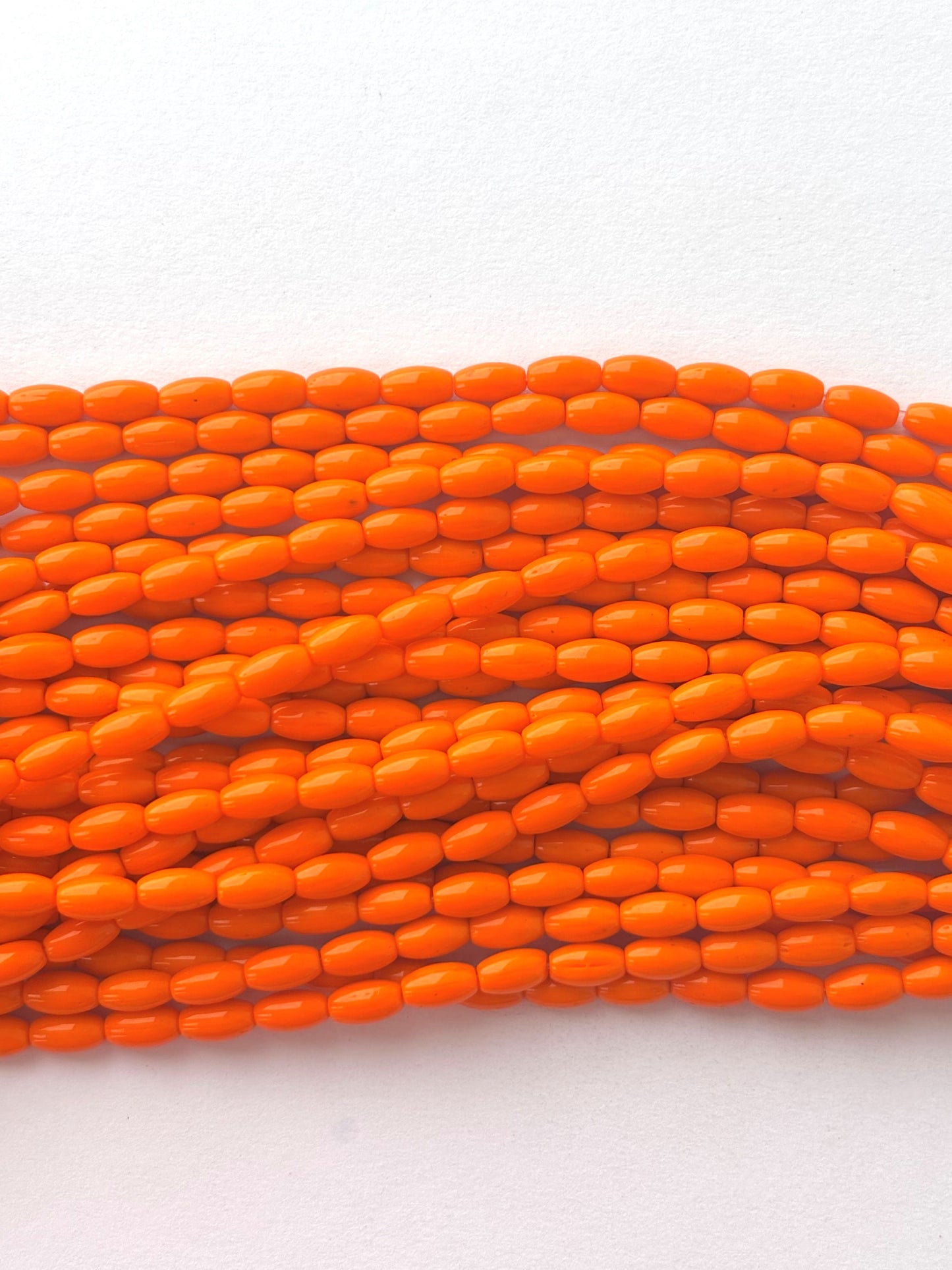 Smooth High Shine Monalisa Bright Orange Oval Beads